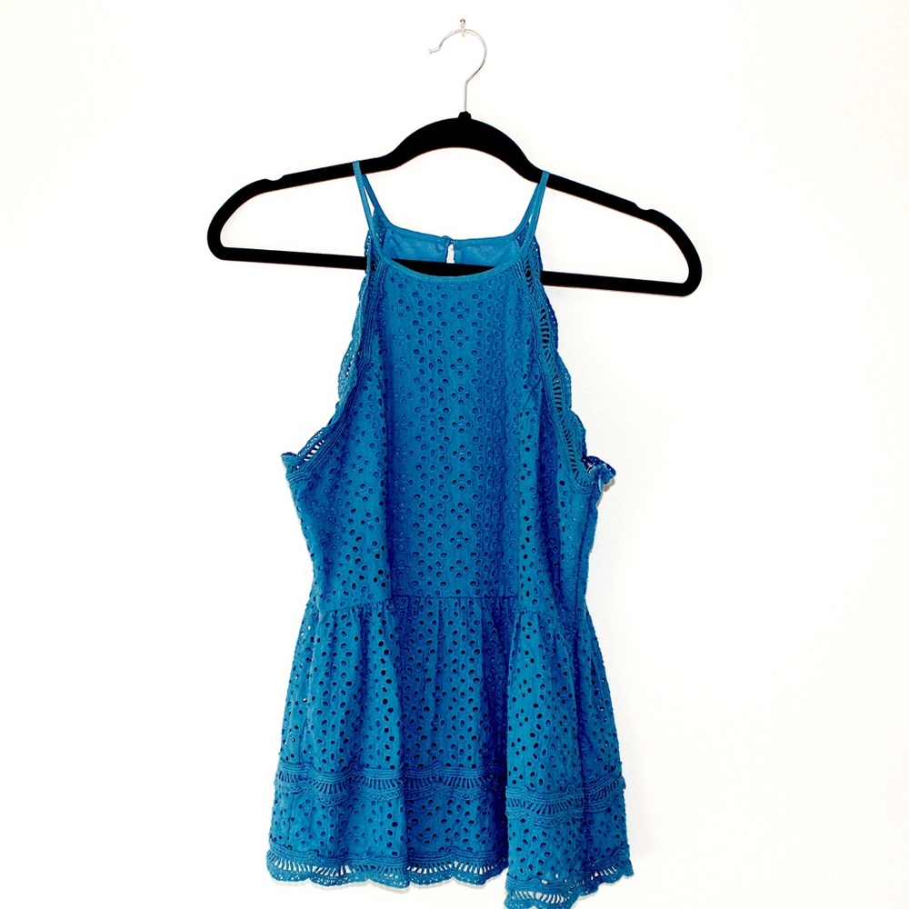 Embroidered eyelet blouse.